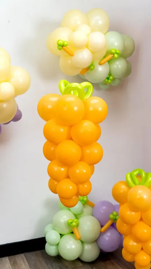 Giant balloon carrots in orange and green