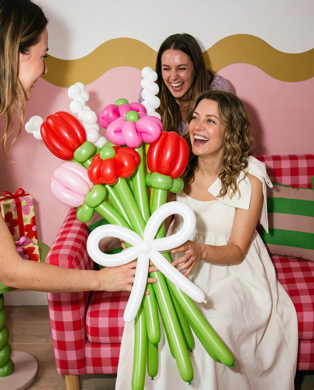 A woman holding a bouquet of balloon flowers